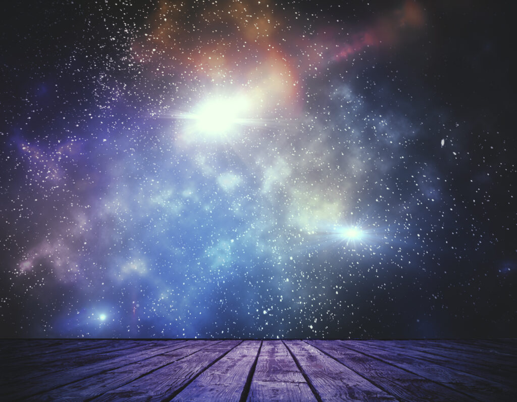 Abstract stage with weathered wooden planks in the foreground opening to a vast starry sky filled with nebula clouds in purple, blue, and warm amber tones, with bright starburst light at center. Used as the featured image for H2P Collective blog post on insights.