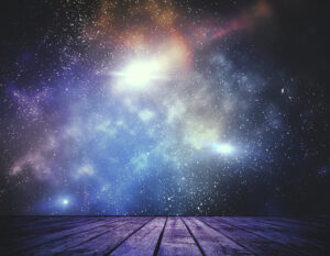 Abstract stage with weathered wooden planks in the foreground opening to a vast starry sky filled with nebula clouds in purple, blue, and warm amber tones, with bright starburst light at center. Used as the featured image for H2P Collective blog post on insights.