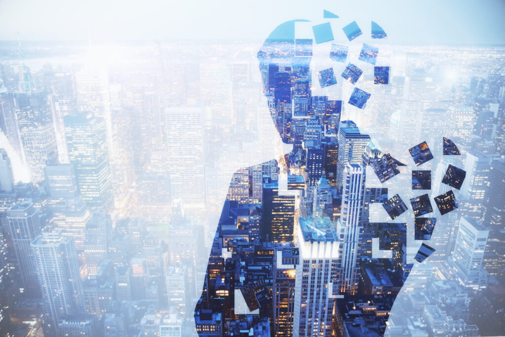 Profile silhouette of a person filled with city imagery, with pieces breaking away from the head into the sky, representing the gap between an outdated identity and the transformed person who has emerged.